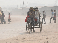 People Make Their Move In A Dusty Busy Road In Dhaka City, Bangladesh, On January 30, 2024. Dhaka City's Air Was Classified As 'very Unhealt...