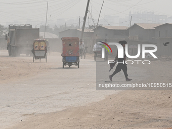 People Make Their Move In A Dusty Busy Road In Dhaka City, Bangladesh, On January 30, 2024. Dhaka City's Air Was Classified As 'very Unhealt...