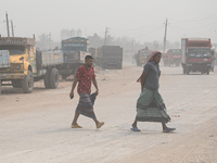 People Make Their Move In A Dusty Busy Road In Dhaka City, Bangladesh, On January 30, 2024. Dhaka City's Air Was Classified As 'very Unhealt...