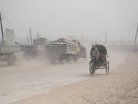 People Make Their Move In A Dusty Busy Road In Dhaka City, Bangladesh, On January 30, 2024. Dhaka City's Air Was Classified As 'very Unhealt...