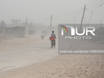 People Make Their Move In A Dusty Busy Road In Dhaka City, Bangladesh, On January 30, 2024. Dhaka City's Air Was Classified As 'very Unhealt...