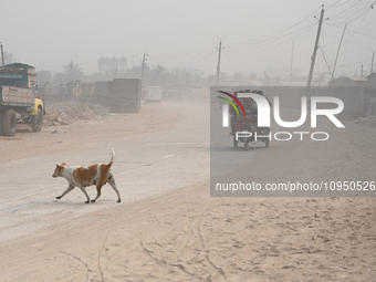 People Make Their Move In A Dusty Busy Road In Dhaka City, Bangladesh, On January 30, 2024. Dhaka City's Air Was Classified As 'very Unhealt...