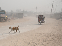 People Make Their Move In A Dusty Busy Road In Dhaka City, Bangladesh, On January 30, 2024. Dhaka City's Air Was Classified As 'very Unhealt...