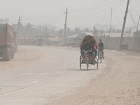 People Make Their Move In A Dusty Busy Road In Dhaka City, Bangladesh, On January 30, 2024. Dhaka City's Air Was Classified As 'very Unhealt...