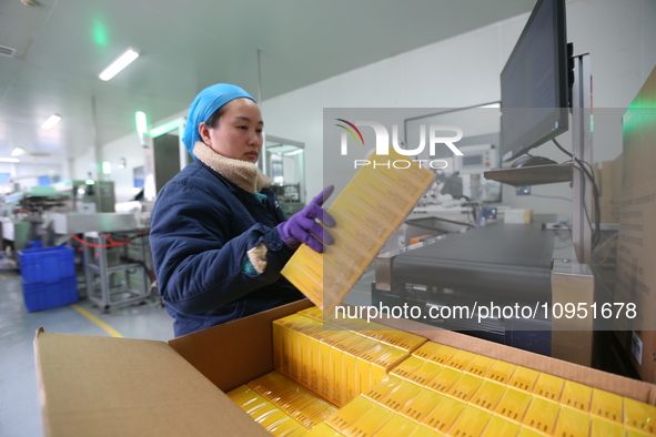 A worker is working on a drug production line at the production workshop of a pharmaceutical company in Meishan, China, on January 30, 2024....