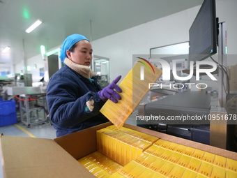 A worker is working on a drug production line at the production workshop of a pharmaceutical company in Meishan, China, on January 30, 2024....