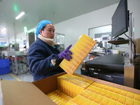 A worker is working on a drug production line at the production workshop of a pharmaceutical company in Meishan, China, on January 30, 2024....