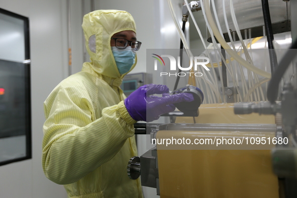 A worker is working on a drug production line at the production workshop of a pharmaceutical company in Meishan, China, on January 30, 2024....