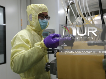 A worker is working on a drug production line at the production workshop of a pharmaceutical company in Meishan, China, on January 30, 2024....