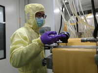 A worker is working on a drug production line at the production workshop of a pharmaceutical company in Meishan, China, on January 30, 2024....