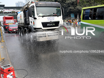 A Truck Sprays Water On A Dusty Road To Minimize Air Pollution By Dhaka North City Corporation In Dhaka, Bangladesh, On January 31, 2024. Dh...