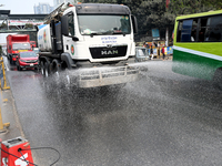 A Truck Sprays Water On A Dusty Road To Minimize Air Pollution By Dhaka North City Corporation In Dhaka, Bangladesh, On January 31, 2024. Dh...