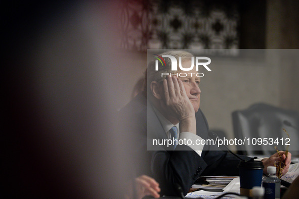 Sen. John Kennedy (R-LA) listens as Meta CEO Mark Zuckerberg answers his question during a Senate Judiciary Committee hearing on the crisis...