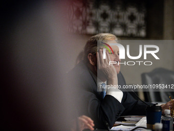 Sen. John Kennedy (R-LA) listens as Meta CEO Mark Zuckerberg answers his question during a Senate Judiciary Committee hearing on the crisis...