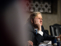 Sen. John Kennedy (R-LA) listens as Meta CEO Mark Zuckerberg answers his question during a Senate Judiciary Committee hearing on the crisis...