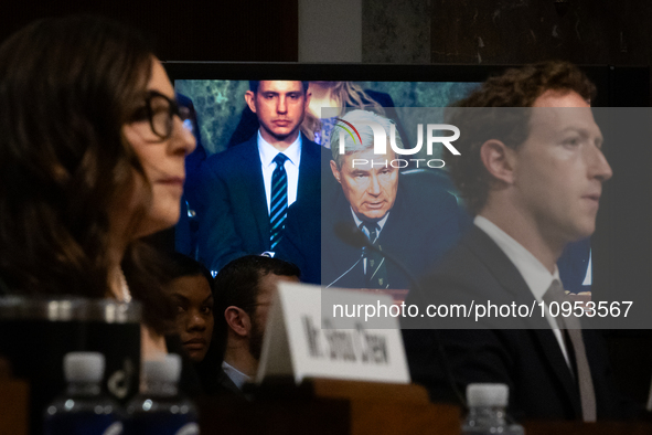 Sen. Sheldon Whitehouse (D-RI) is visible between X (Twitter) and Meta CEOs, Linda Yaccarino and Mark Zuckerberg, on a large monitor as he q...