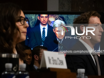 Sen. Sheldon Whitehouse (D-RI) is visible between X (Twitter) and Meta CEOs, Linda Yaccarino and Mark Zuckerberg, on a large monitor as he q...