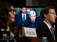 Sen. Sheldon Whitehouse (D-RI) is visible between X (Twitter) and Meta CEOs, Linda Yaccarino and Mark Zuckerberg, on a large monitor as he q...