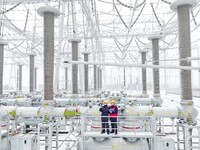 Power workers are carrying out a post-snow inspection of power supply equipment at a 500-kilovolt substation in Meizhuang village, Chuzhou c...