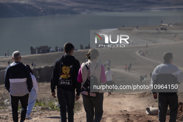 Hundreds of people are visiting the old town of Sant Roma de Sau, where normally the water of the Sau reservoir would almost completely cove...