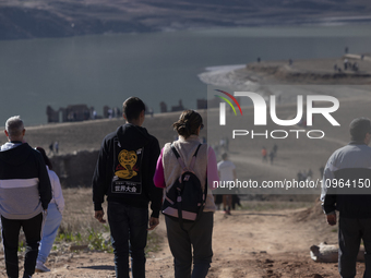 Hundreds of people are visiting the old town of Sant Roma de Sau, where normally the water of the Sau reservoir would almost completely cove...