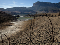 Hundreds of people are visiting the old town of Sant Roma de Sau, where normally the water of the Sau reservoir would almost completely cove...