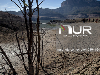 Hundreds of people are visiting the old town of Sant Roma de Sau, where normally the water of the Sau reservoir would almost completely cove...