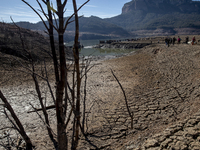 Hundreds of people are visiting the old town of Sant Roma de Sau, where normally the water of the Sau reservoir would almost completely cove...