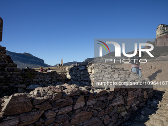 Hundreds of people are visiting the old town of Sant Roma de Sau, where normally the water of the Sau reservoir would almost completely cove...