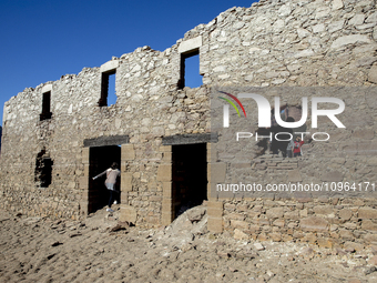 Hundreds of people are visiting the old town of Sant Roma de Sau, where normally the water of the Sau reservoir would almost completely cove...