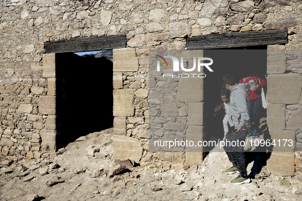 Hundreds of people are visiting the old town of Sant Roma de Sau, where normally the water of the Sau reservoir would almost completely cove...