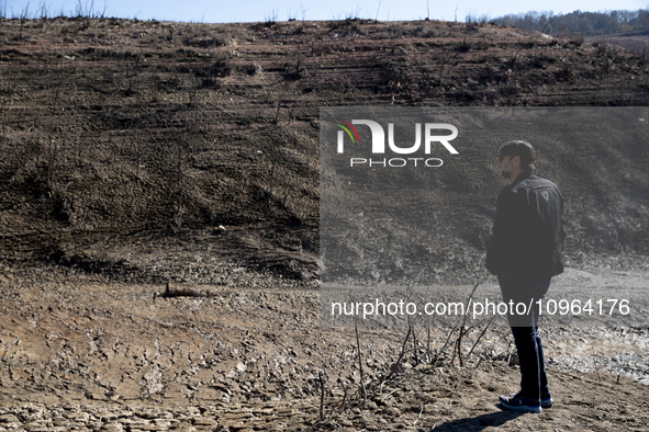 Hundreds of people are visiting the old town of Sant Roma de Sau, where normally the water of the Sau reservoir would almost completely cove...