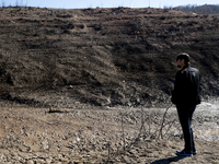 Hundreds of people are visiting the old town of Sant Roma de Sau, where normally the water of the Sau reservoir would almost completely cove...