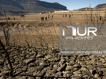 Hundreds of people are visiting the old town of Sant Roma de Sau, where normally the water of the Sau reservoir would almost completely cove...