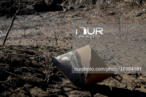 Hundreds of people are visiting the old town of Sant Roma de Sau, where normally the water of the Sau reservoir would almost completely cove...