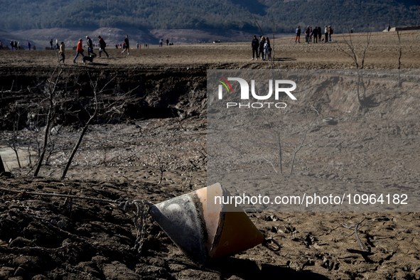 Hundreds of people are visiting the old town of Sant Roma de Sau, where normally the water of the Sau reservoir would almost completely cove...