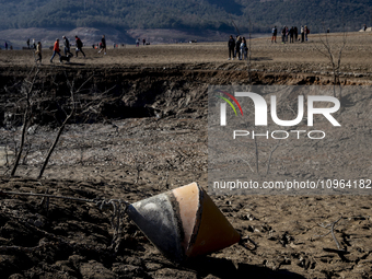 Hundreds of people are visiting the old town of Sant Roma de Sau, where normally the water of the Sau reservoir would almost completely cove...