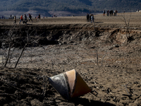 Hundreds of people are visiting the old town of Sant Roma de Sau, where normally the water of the Sau reservoir would almost completely cove...