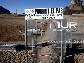 Hundreds of people are visiting the old town of Sant Roma de Sau, where normally the water of the Sau reservoir would almost completely cove...