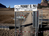 Hundreds of people are visiting the old town of Sant Roma de Sau, where normally the water of the Sau reservoir would almost completely cove...