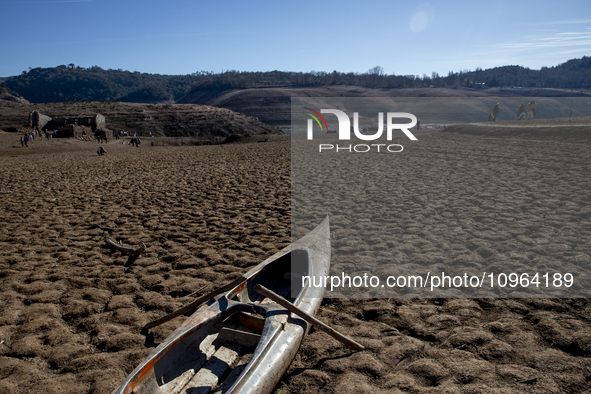 Hundreds of people are visiting the old town of Sant Roma de Sau, where normally the water of the Sau reservoir would almost completely cove...