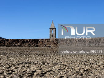 Hundreds of people are visiting the old town of Sant Roma de Sau, where normally the water of the Sau reservoir would almost completely cove...