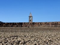 Hundreds of people are visiting the old town of Sant Roma de Sau, where normally the water of the Sau reservoir would almost completely cove...