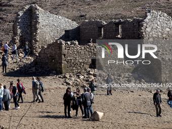 Hundreds of people are visiting the old town of Sant Roma de Sau, where normally the water of the Sau reservoir would almost completely cove...