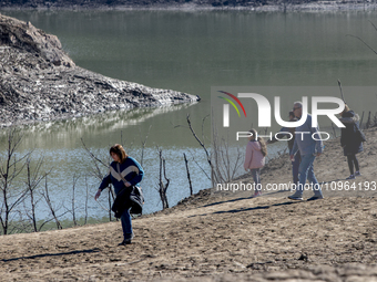 Hundreds of people are visiting the old town of Sant Roma de Sau, where normally the water of the Sau reservoir would almost completely cove...