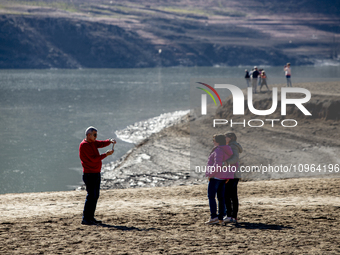 Hundreds of people are visiting the old town of Sant Roma de Sau, where normally the water of the Sau reservoir would almost completely cove...