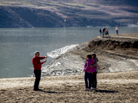 Hundreds of people are visiting the old town of Sant Roma de Sau, where normally the water of the Sau reservoir would almost completely cove...