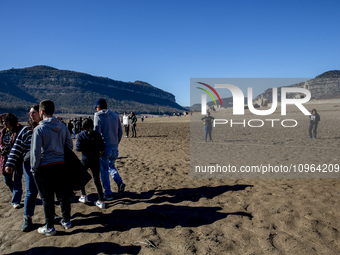 Hundreds of people are visiting the old town of Sant Roma de Sau, where normally the water of the Sau reservoir would almost completely cove...