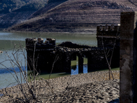 Hundreds of people are visiting the old town of Sant Roma de Sau, where normally the water of the Sau reservoir would almost completely cove...