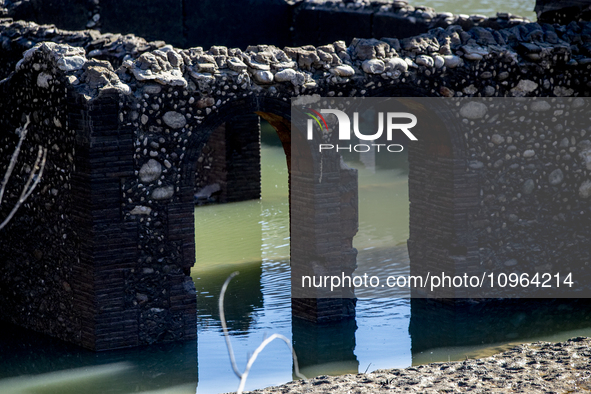 Hundreds of people are visiting the old town of Sant Roma de Sau, where normally the water of the Sau reservoir would almost completely cove...